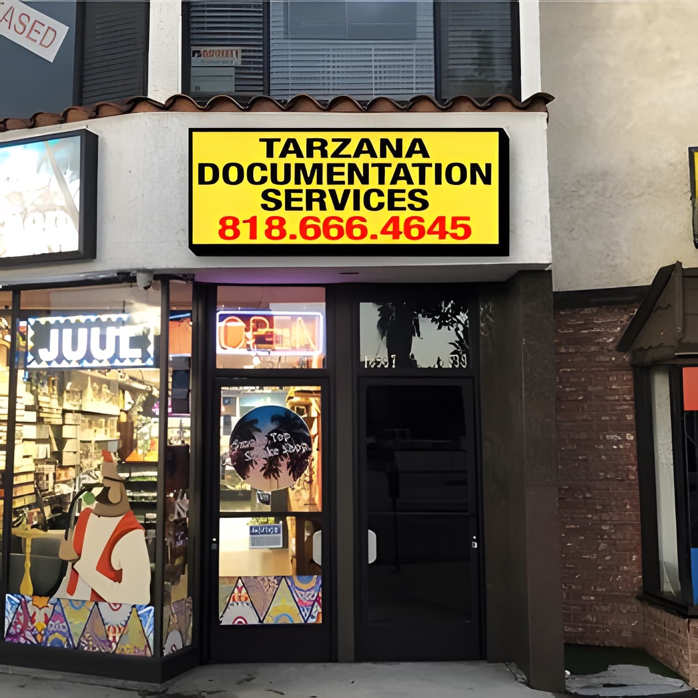 Street entrance of Tarzana Documentation Services on Ventura Blvd, marked by a large yellow sign